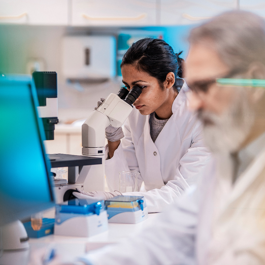 Female Scientist Working in The Lab, Using Microscope