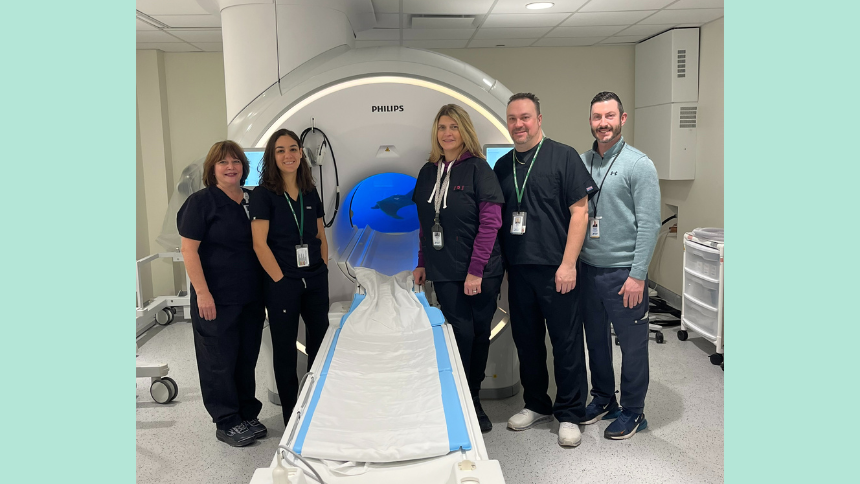 Northern Dutchess Hospital radiology team in front of Philips Ambient Experience MRI machine. 