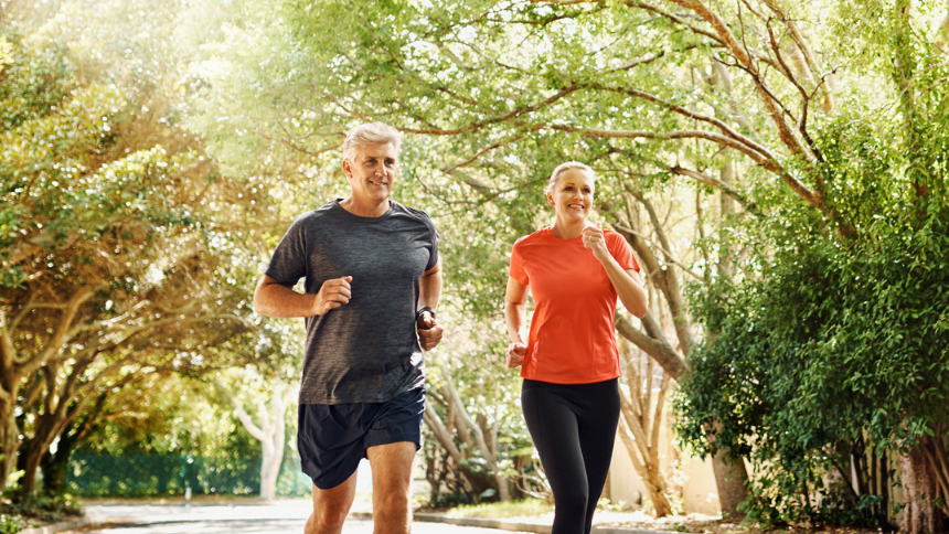 Shot of a mature couple out jogging on a sunny day.