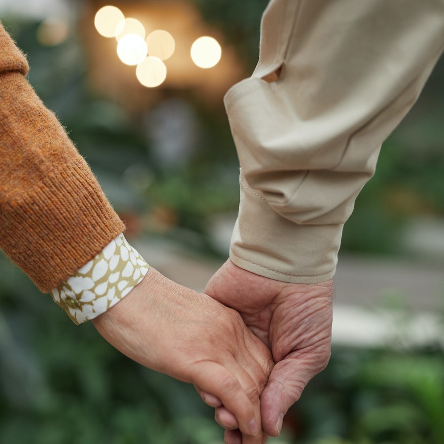 Close up of couple holding hands