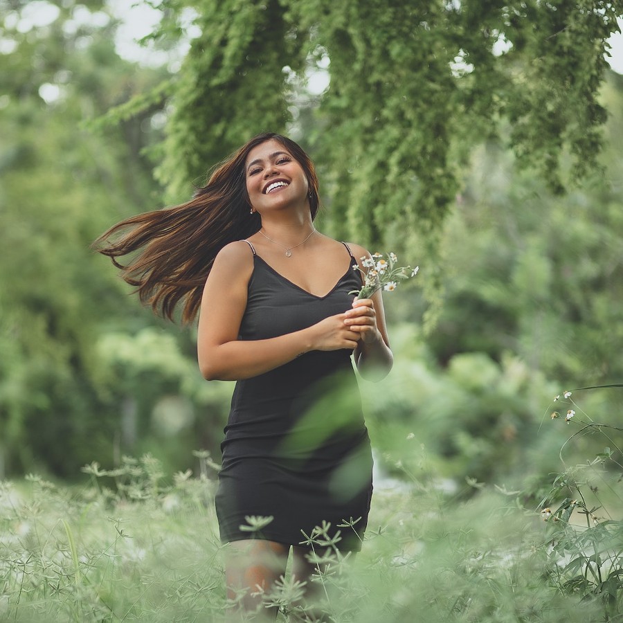 Happy woman holding flowers