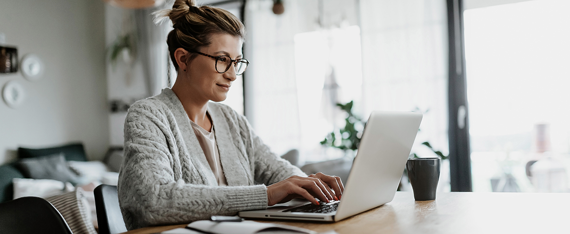 woman typing on laptop