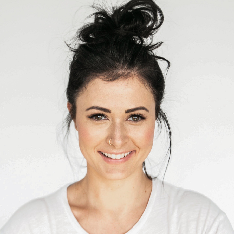 Portrait of a brunette woman smiling with nose ring