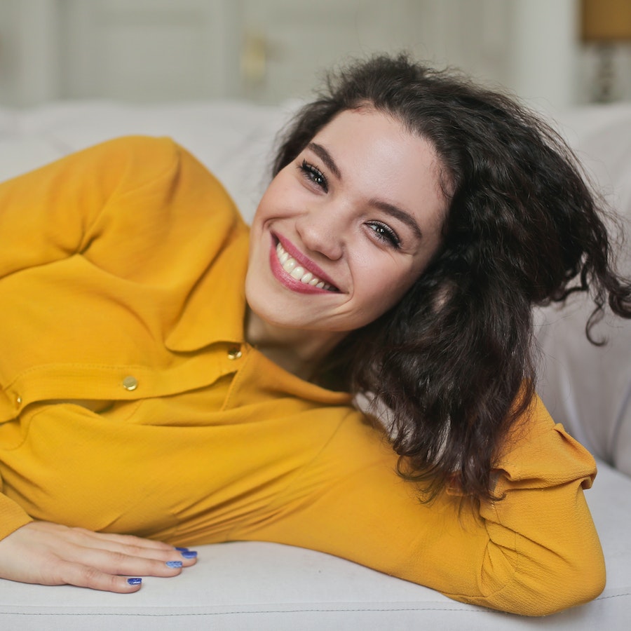 Woman in yellow button down shirt 