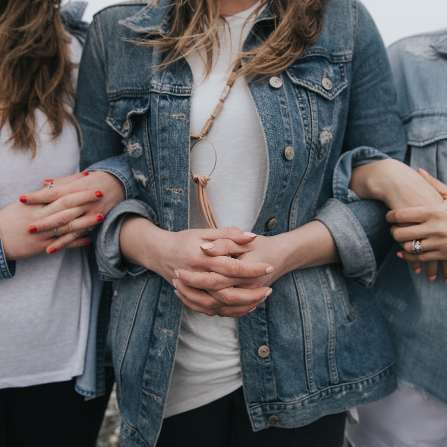 Women with linked arms